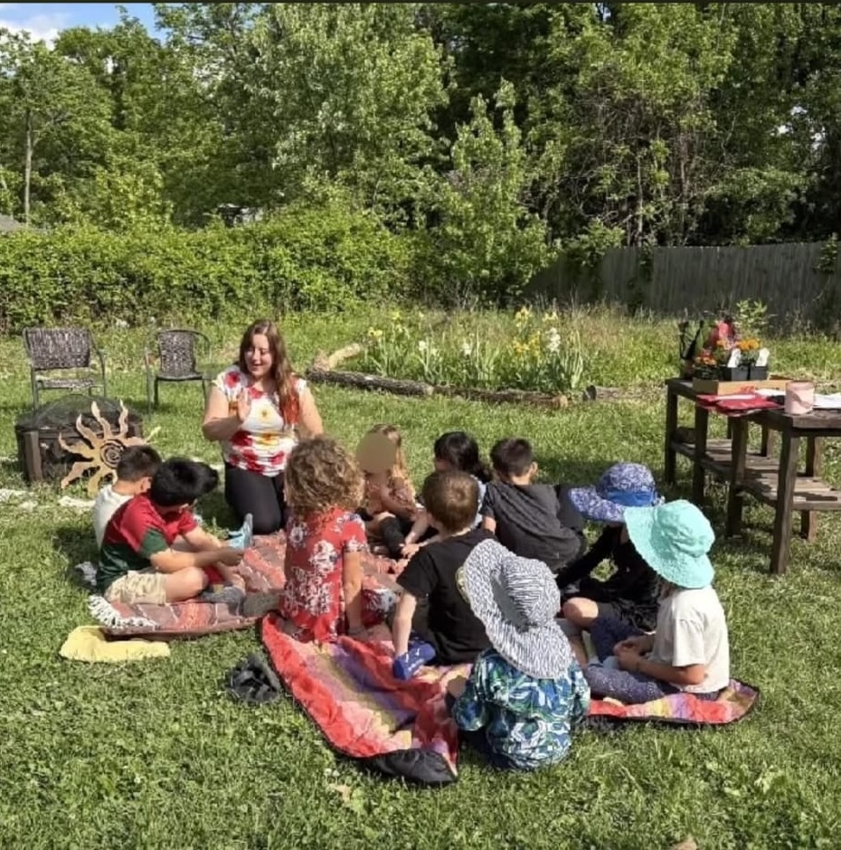 Teacher leading a Spanish lesson with young students.